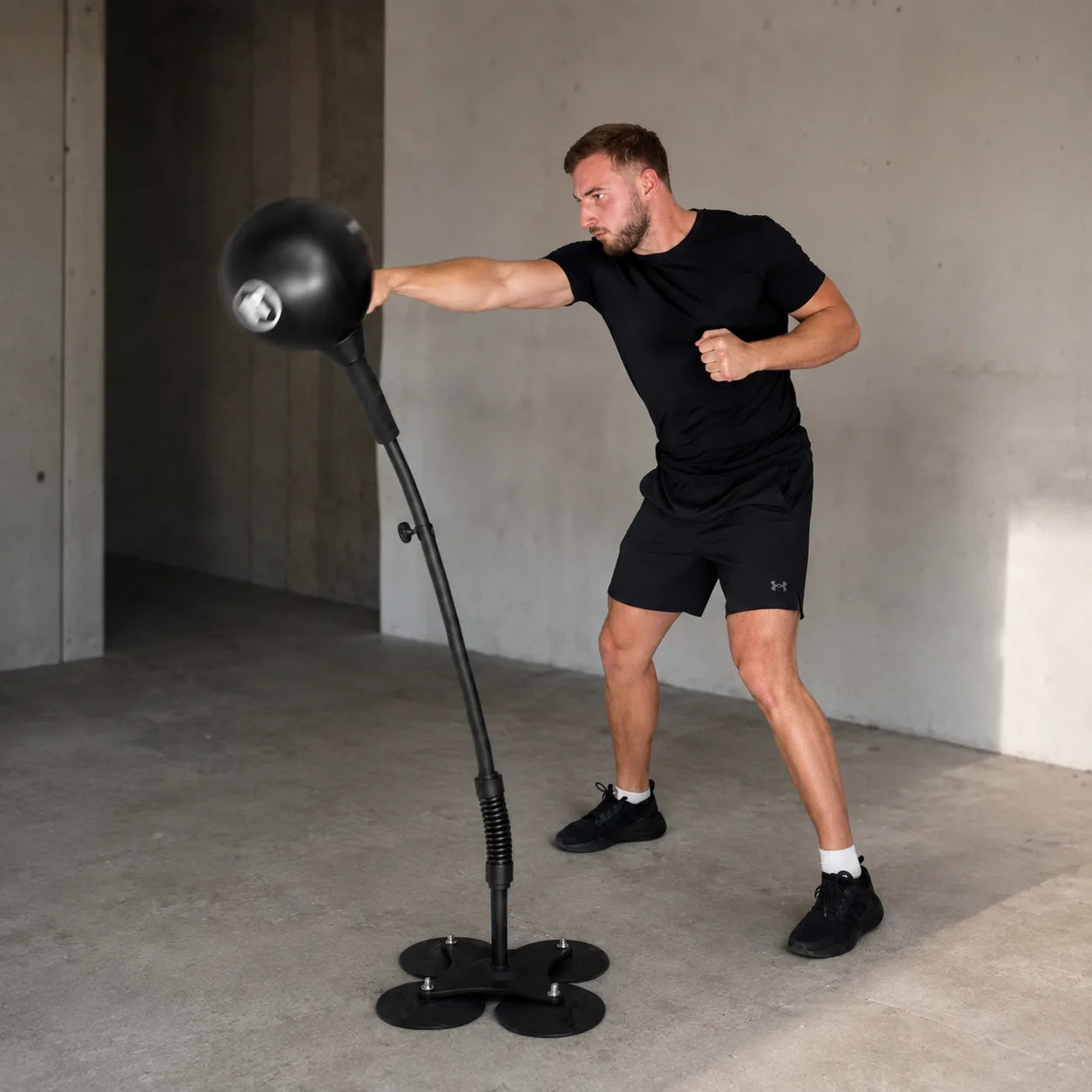An adult punching the Big Rage Bag