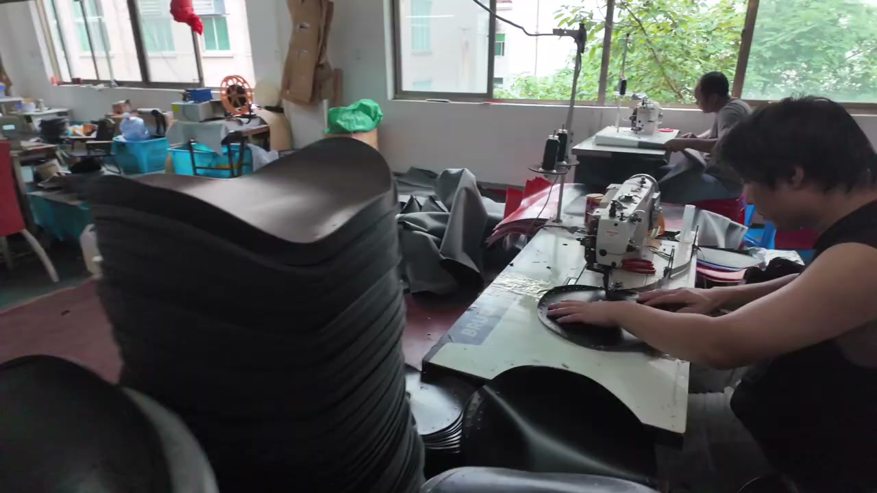 Bag covers being sewn during the FUNPUNCH team's factory visit in China