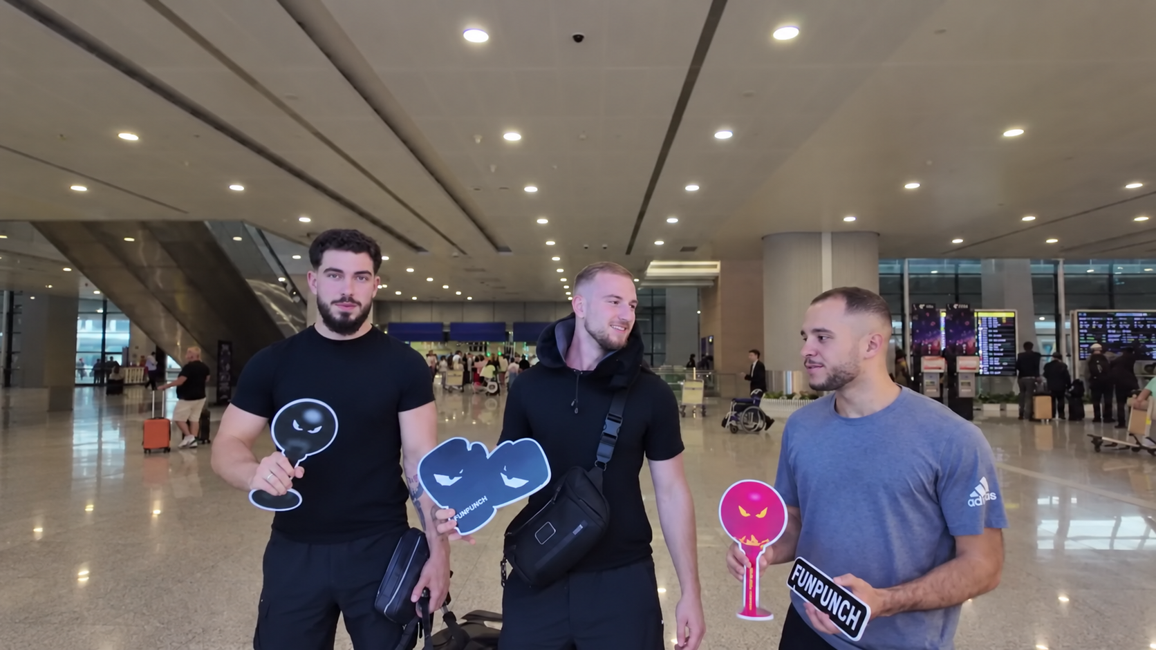 Pavle, Nart and Tim together at the airport with FUNPUNCH cutouts