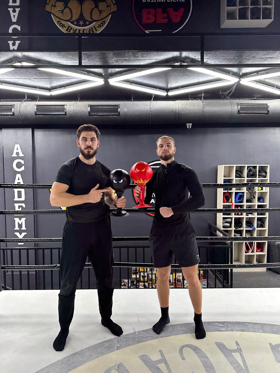 Two of the FUNPUNCH founders holding the bags at a boxing gym