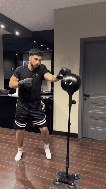 Ten second loop of an adult punching the Big Rage Bag, with the floor base visible